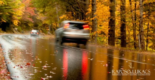 car in wet roads in autumn